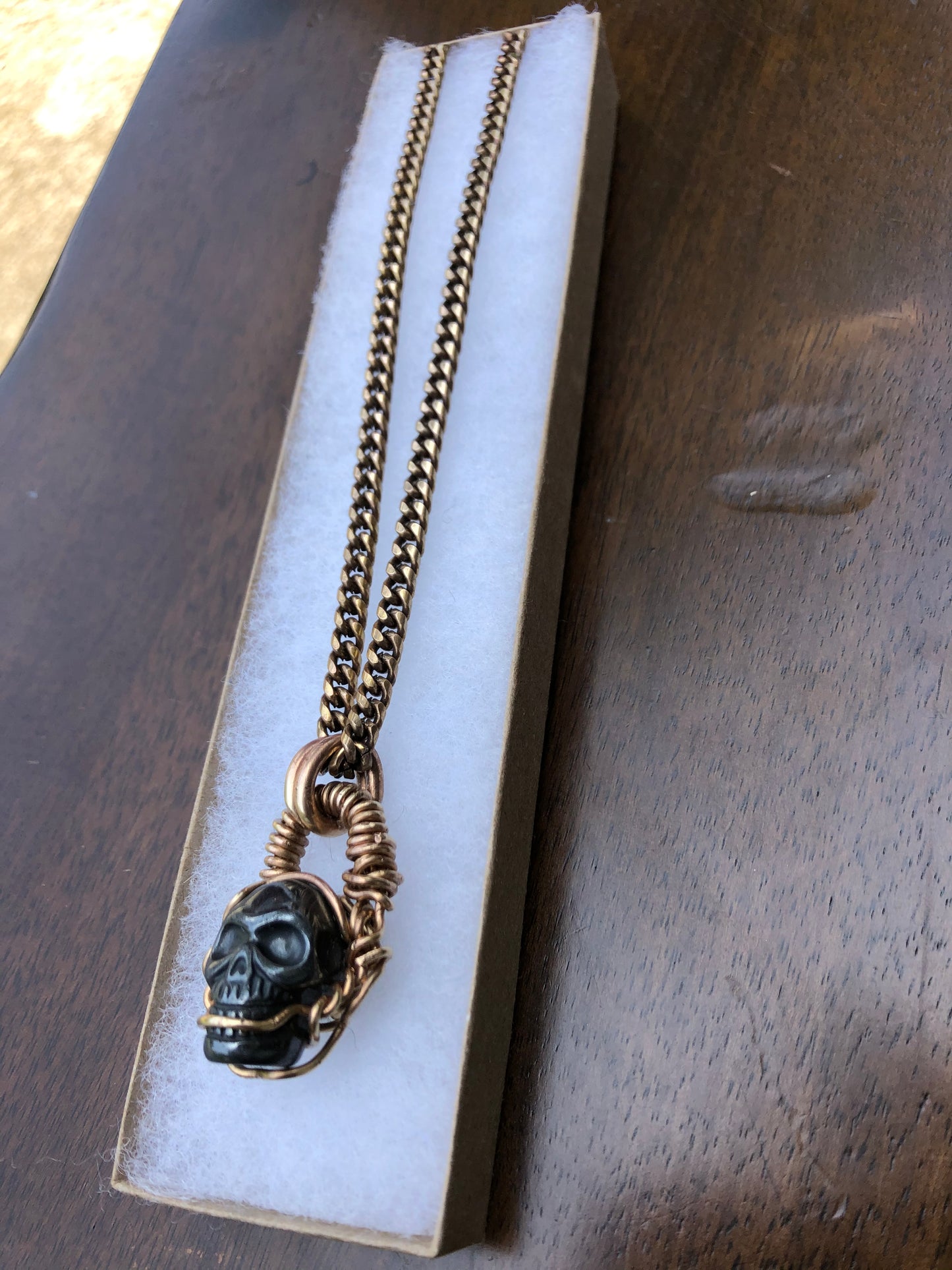 Hematite Brass Skull Amulet