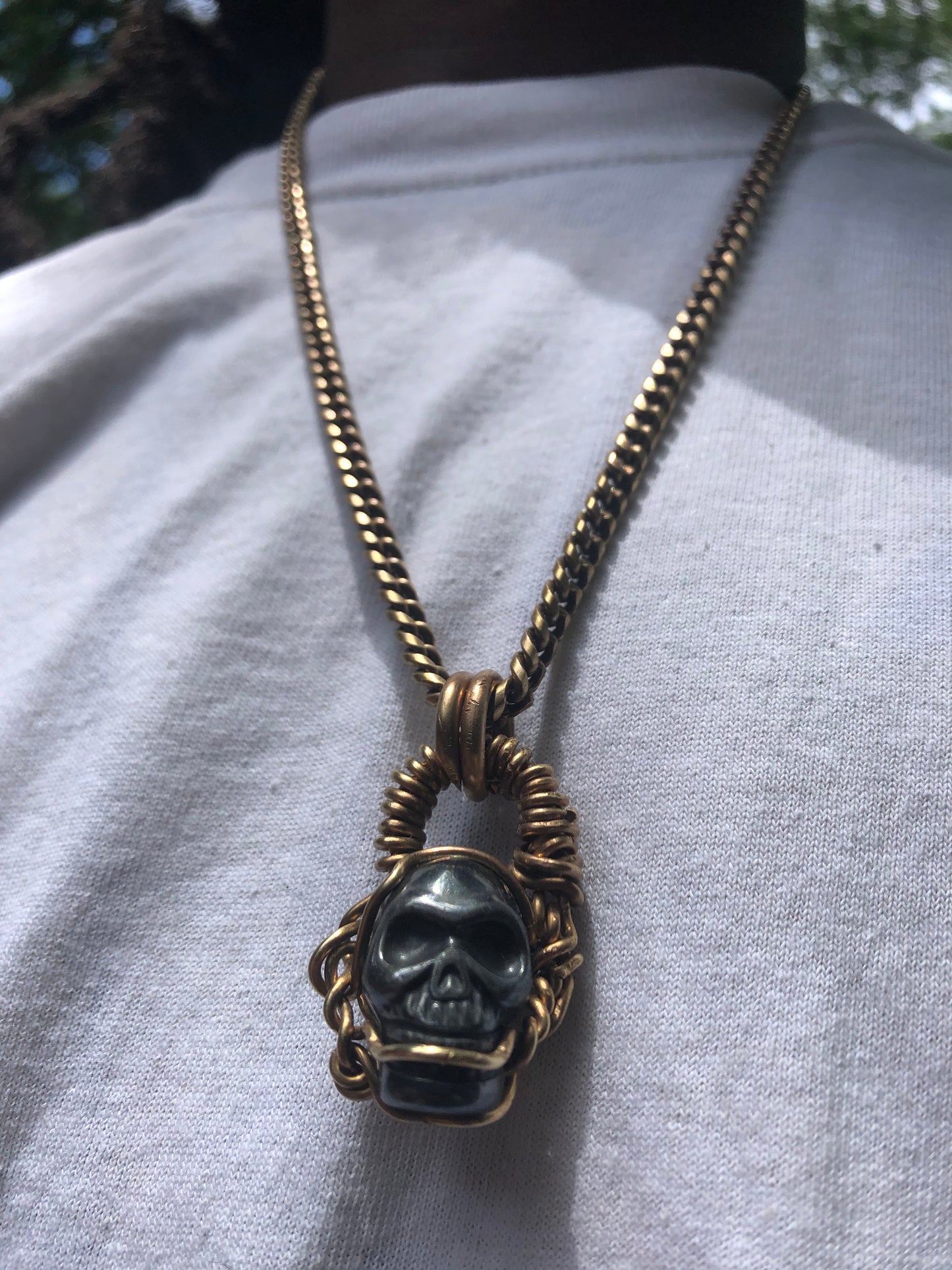 Hematite Brass Skull Amulet